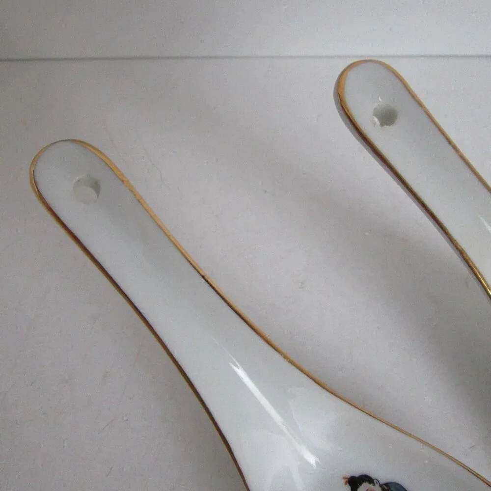 pair of porcelain soup spoons